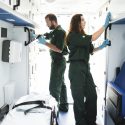 Paramedic team checking equipment in an ambulance
